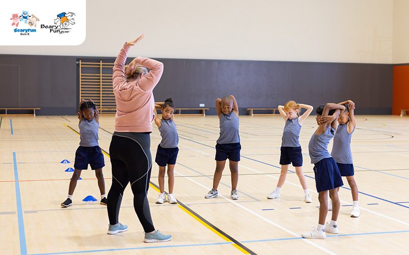 Teacher conducting a stretching exercise during gym class