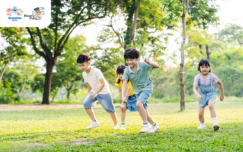 Children running and playing in a park.