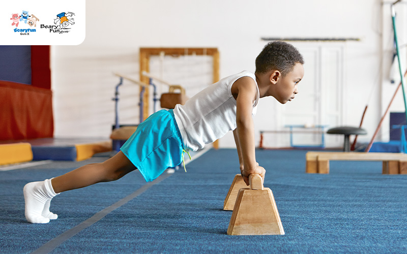Preschooler stretching during gym class