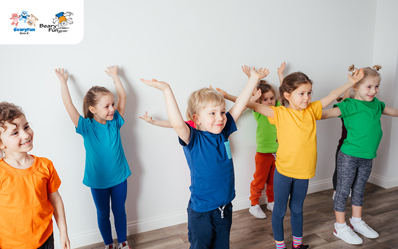 children doing movements to strengthen literacy skills at BearyFun Gym