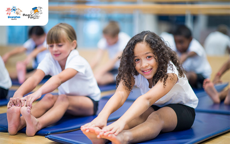 Child gymnasts on safety mats