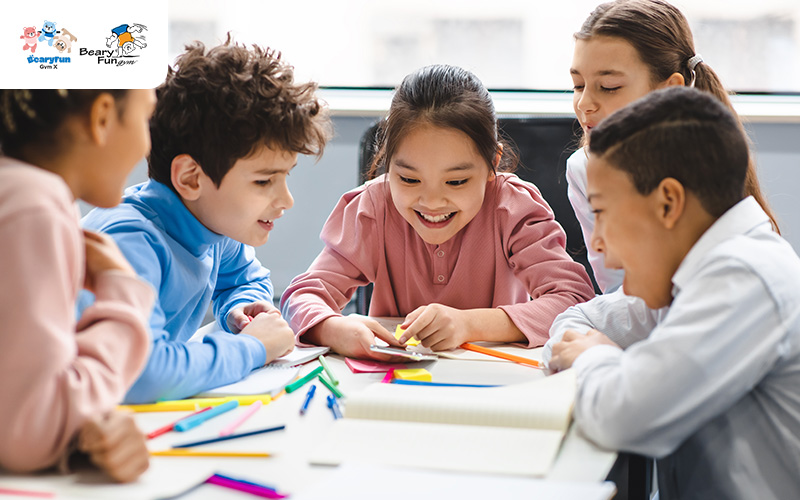Children working together on a group project at BearyFunGym.