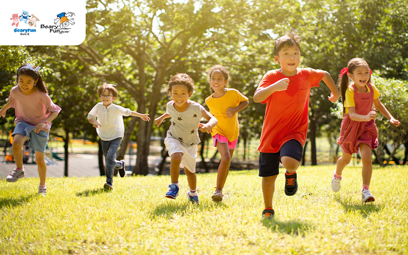 Group of children running and playing in the park.