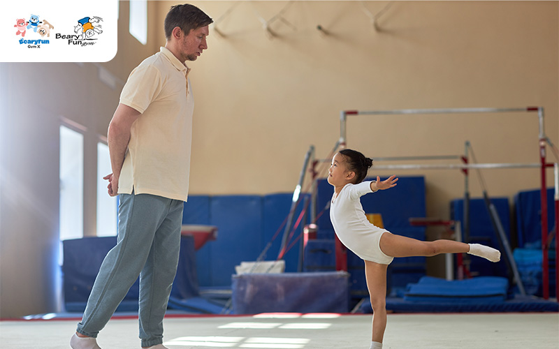 A gym coach watching over a child